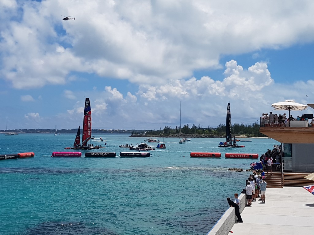 The victorious Emirates Team New Zealand just after winning the final race - view from the Gosling's Rum Stand